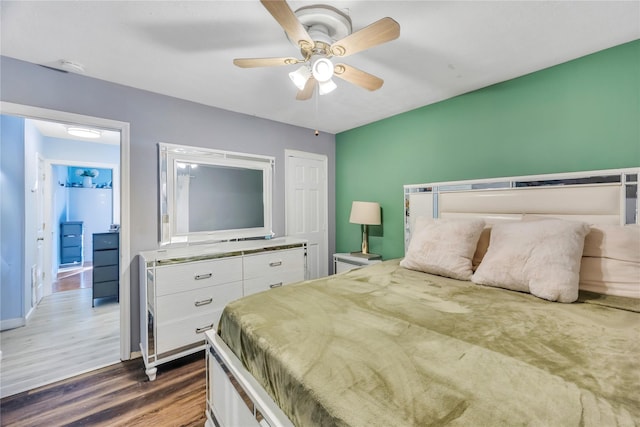 bedroom with ceiling fan and dark wood-type flooring