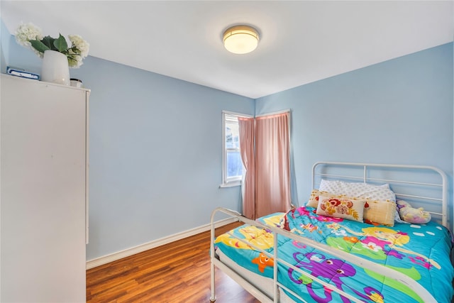 bedroom featuring wood-type flooring