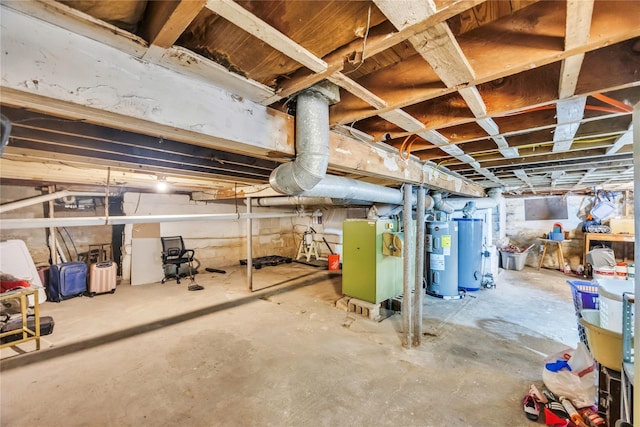 basement with heating unit, gas water heater, and water heater