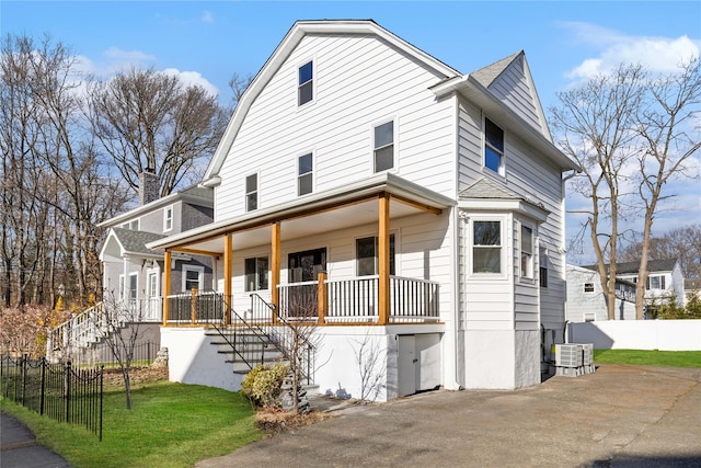 view of front of home featuring a front yard and a porch