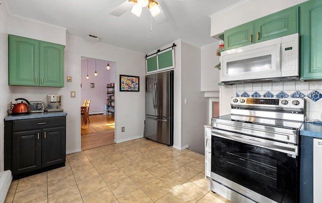 kitchen featuring ceiling fan, light tile patterned flooring, backsplash, and appliances with stainless steel finishes