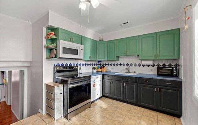 kitchen with light tile patterned floors, backsplash, stainless steel electric stove, and sink