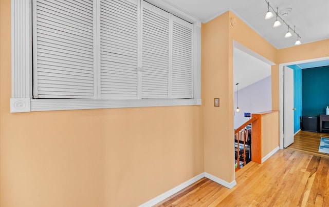 hall with hardwood / wood-style floors