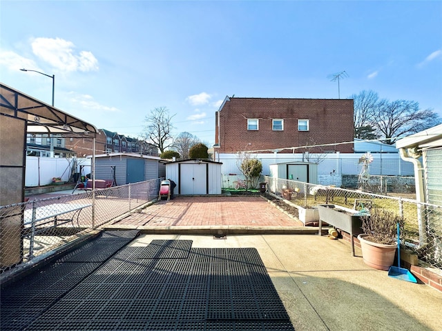 view of patio featuring a shed