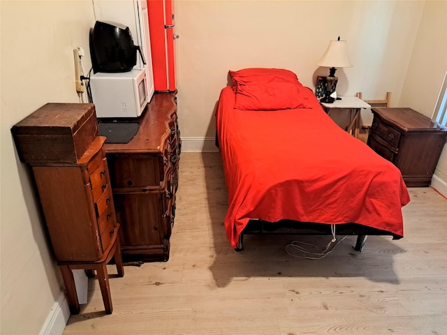 bedroom featuring light wood-type flooring