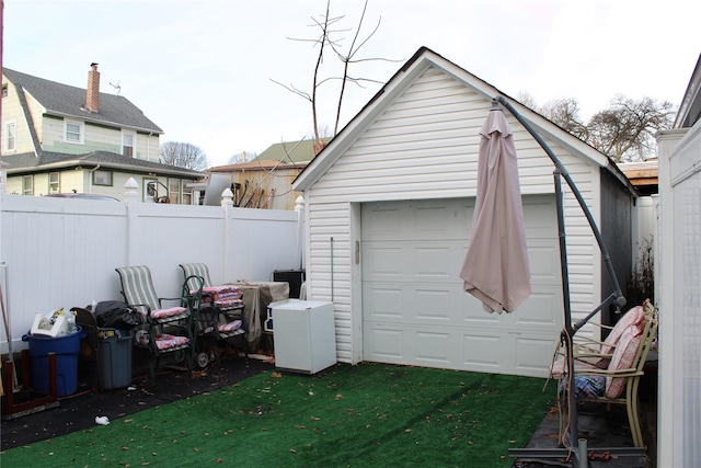 garage featuring a yard