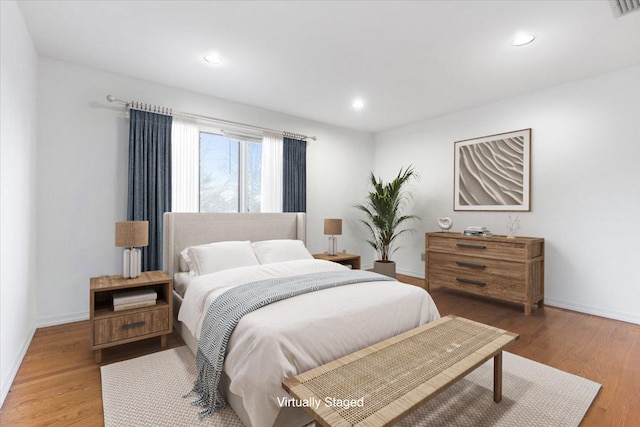 bedroom with wood-type flooring