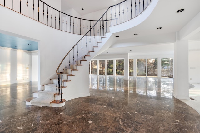 stairway with a high ceiling