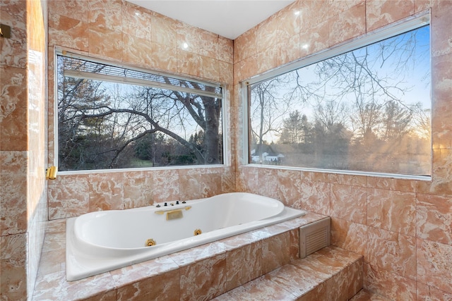 bathroom with tiled tub