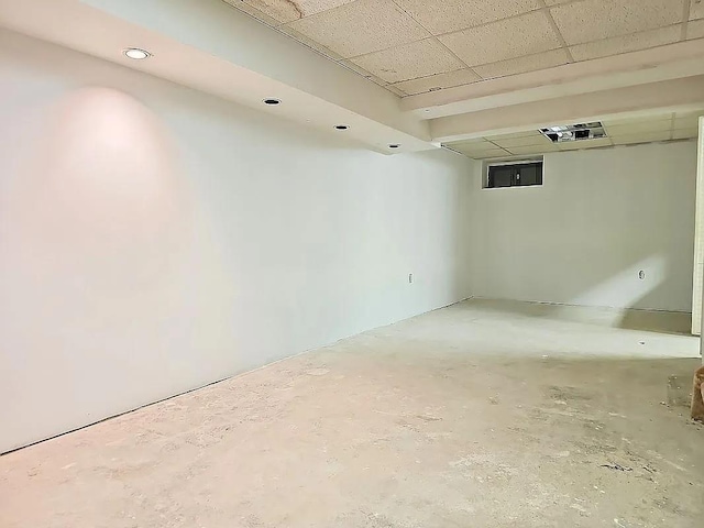 basement featuring a drop ceiling