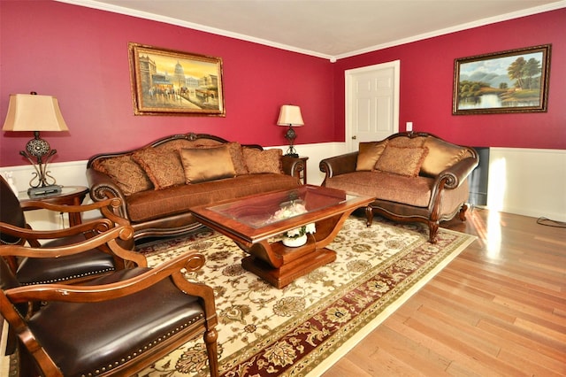 living room featuring crown molding and light hardwood / wood-style flooring