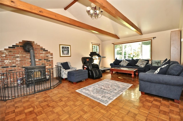 living room featuring lofted ceiling with beams, an inviting chandelier, a wood stove, and light parquet floors