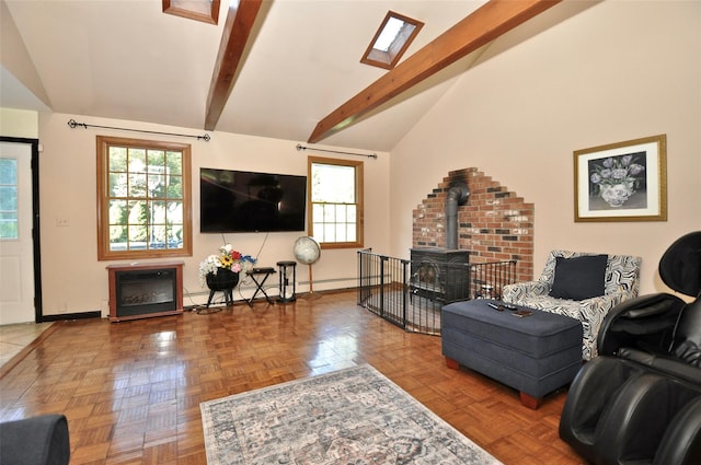 living room featuring parquet flooring, a wood stove, baseboard heating, and lofted ceiling with skylight