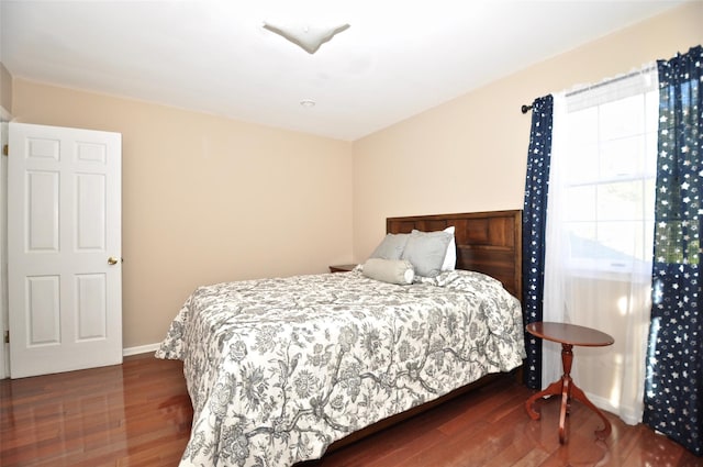 bedroom featuring dark hardwood / wood-style floors