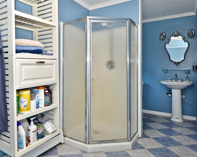 bathroom featuring crown molding and a shower with shower door