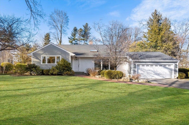 single story home featuring a front lawn and a garage