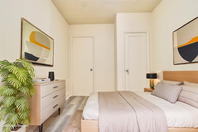 bedroom with light hardwood / wood-style flooring