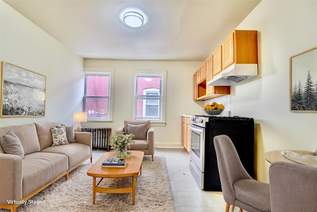 tiled living room featuring radiator heating unit