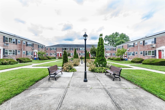 surrounding community featuring a lawn