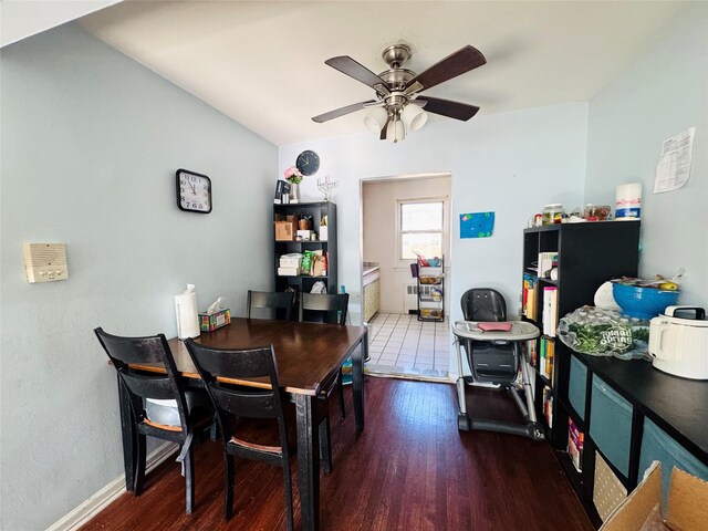 dining area featuring wood-type flooring and ceiling fan