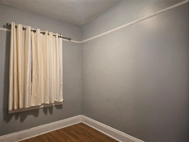 unfurnished room with hardwood / wood-style flooring