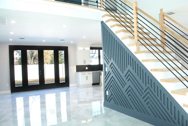 staircase featuring french doors