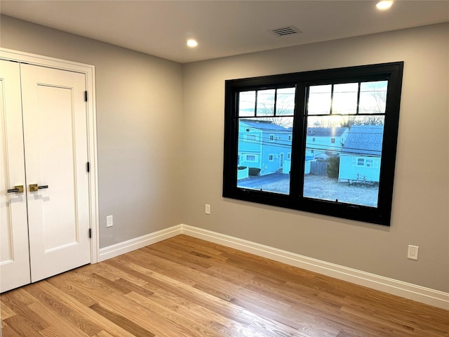 spare room featuring light hardwood / wood-style flooring