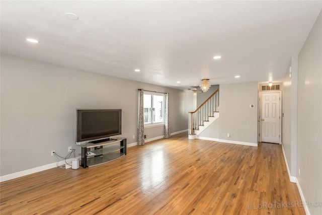 unfurnished living room featuring light hardwood / wood-style floors