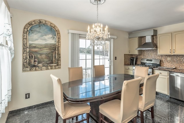 dining area featuring a notable chandelier