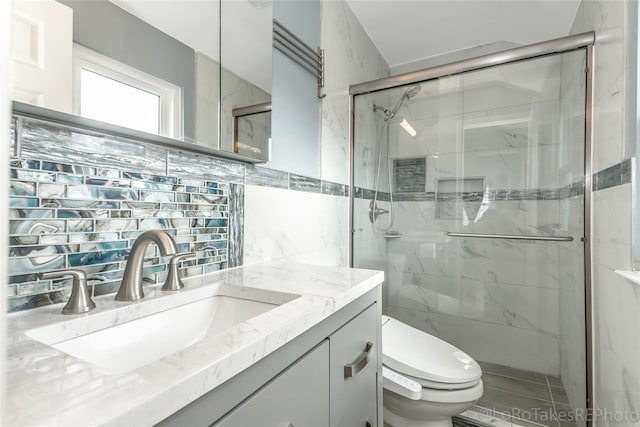 bathroom with decorative backsplash, an enclosed shower, vanity, tile walls, and toilet