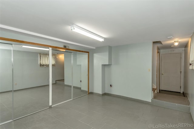 basement with light tile patterned floors