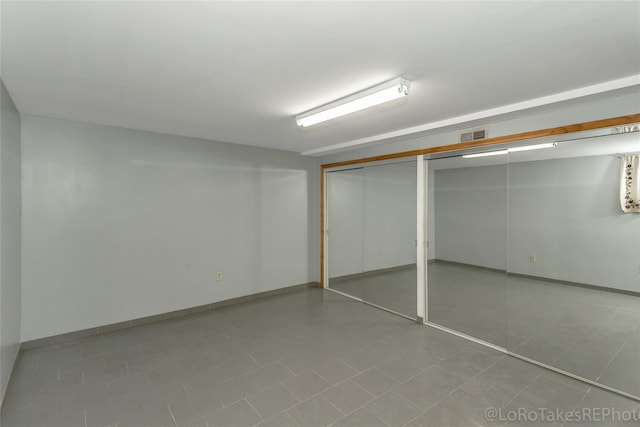 basement featuring tile patterned flooring