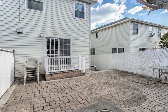 back of house featuring cooling unit and a patio area