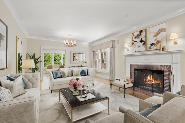 living room featuring a brick fireplace, ornamental molding, and a notable chandelier