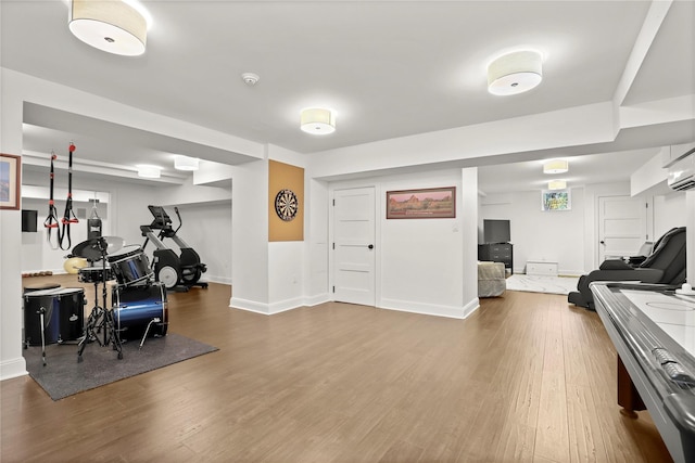 workout area with wood-type flooring