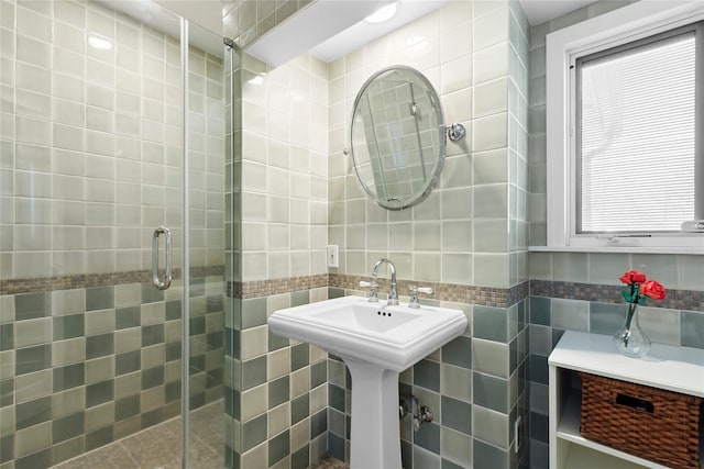 bathroom featuring an enclosed shower and tile walls