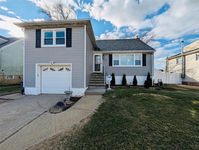 tri-level home with a front lawn and a garage