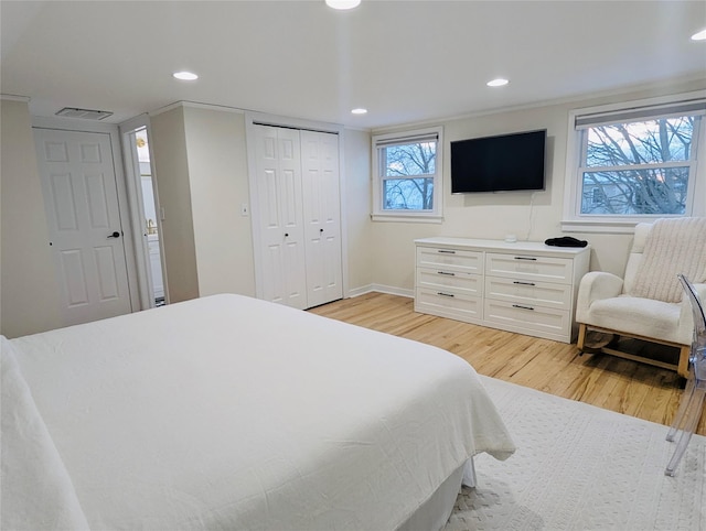 bedroom with light hardwood / wood-style floors