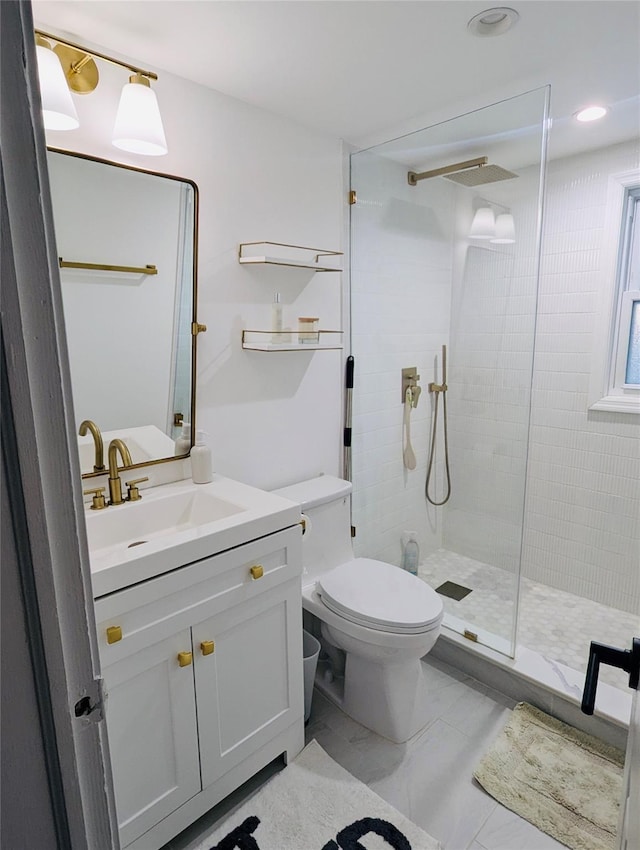 bathroom featuring tile patterned floors, vanity, toilet, and an enclosed shower