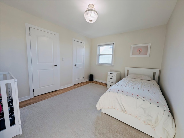 bedroom with light wood-type flooring