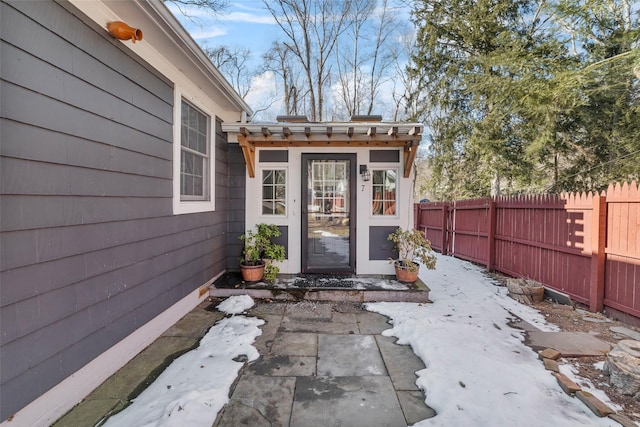 view of snow covered property entrance