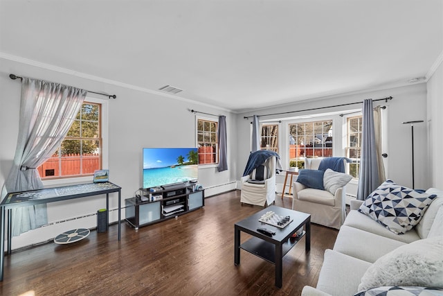 living room with dark hardwood / wood-style flooring, a baseboard heating unit, and crown molding