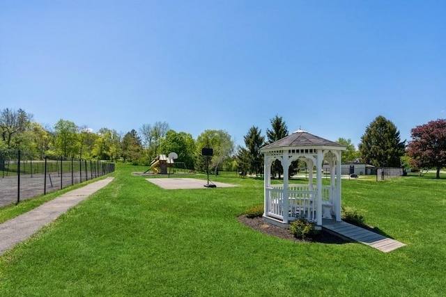 view of home's community with a gazebo and a yard