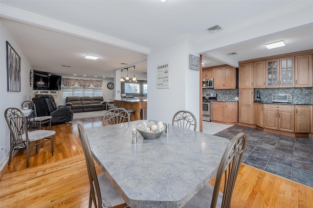 dining area featuring light wood-type flooring