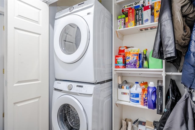 laundry area with stacked washing maching and dryer