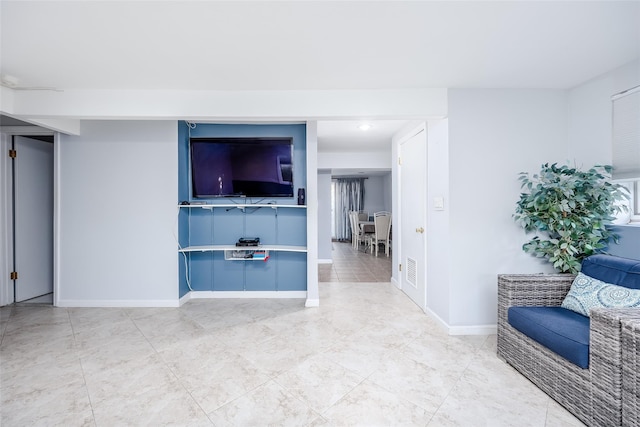 unfurnished living room with tile patterned floors