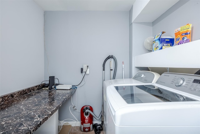 laundry area with washing machine and clothes dryer