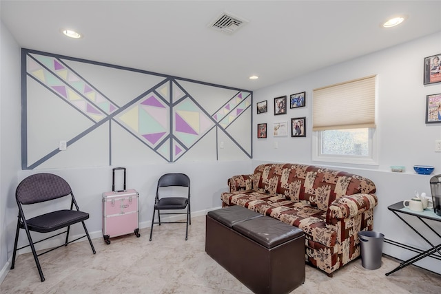 living room with a baseboard heating unit