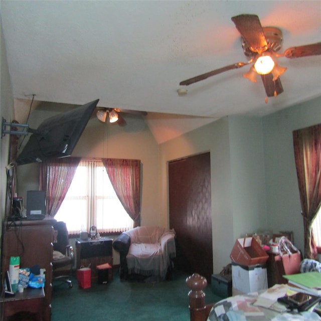 carpeted bedroom featuring ceiling fan and lofted ceiling