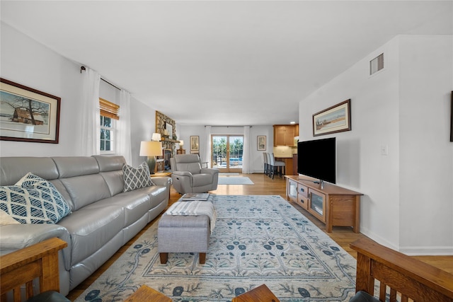 living room with light hardwood / wood-style floors